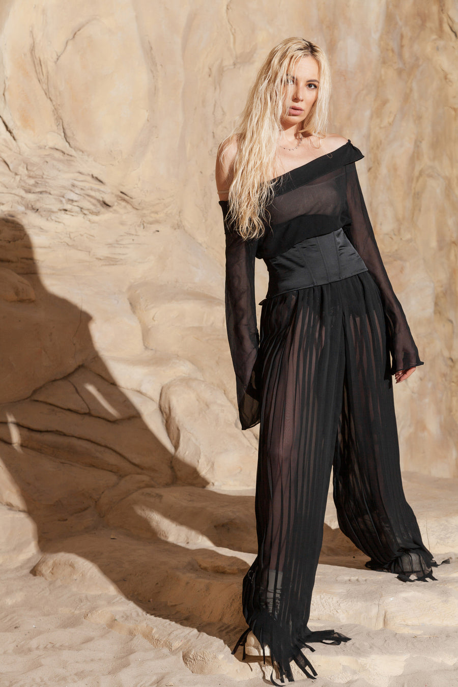 PLEATED PANTS WITH ASYMMETRICAL HEM