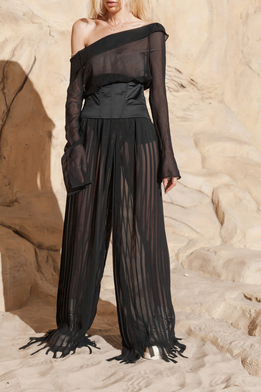 PLEATED PANTS WITH ASYMMETRICAL HEM