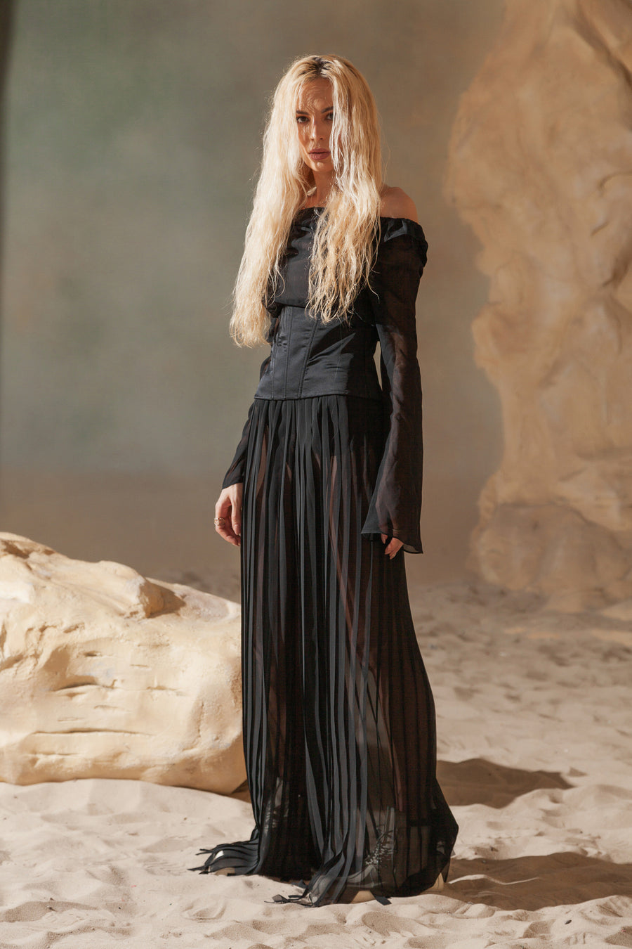 PLEATED PANTS WITH ASYMMETRICAL HEM